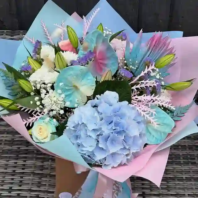 Pastel blue and pink hand-tied bouquet by The Flower Shaq