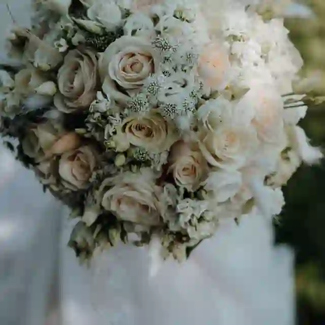 Cream and blush wedding bouquet of roses by The Flower Shaq