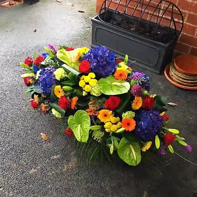 Vibrant multi-colour bespoke floral spray by The Flower Shaq