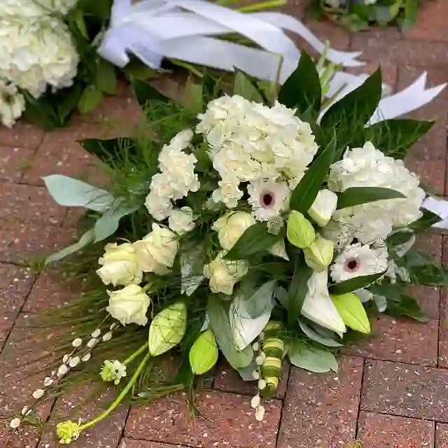 Cream and white sympathy arrangement by The Flower Shaq