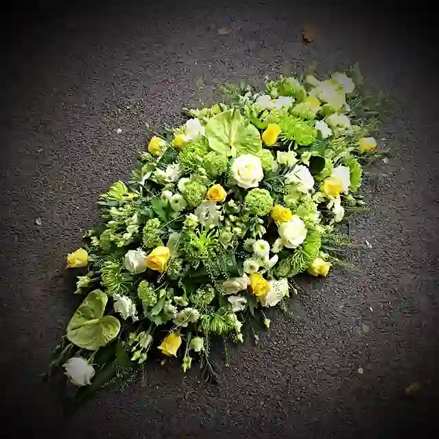 Green, white and yellow teardrop spray by The Flower Shaq